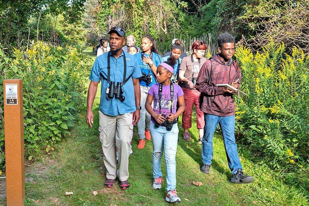 Wildlife photographer Dudley Edmondson leads a bird walk near Cleveland. Photo by Bob Perkoski.