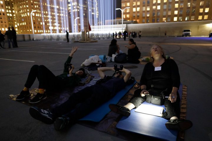 Volunteers monitor birds late into the night. Photo by Ben Norman.