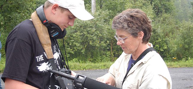 student learns how to use audio recording equipment